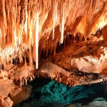 Stalactites hanging above the water
