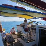 Enjoy shade near the captain and learn about Bermuda's waters.